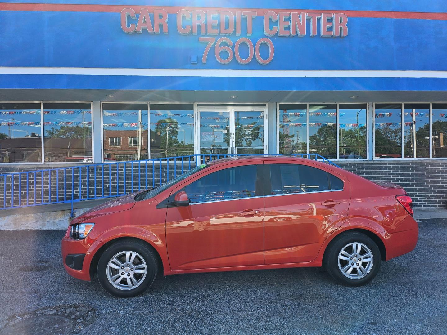 2012 ORANGE Chevrolet Sonic 1LT Sedan (1G1JD5SB8C4) with an 1.4L L4 DOHC 24V TURBO FFV engine, located at 7600 S Western Ave., Chicago, IL, 60620, (773) 918-3980, 0.000000, 0.000000 - Photo#0